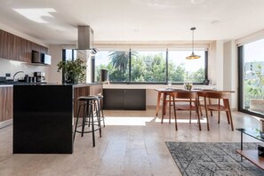 Fridge, microwave, stovetop, coffee/tea maker