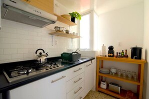 Fridge, microwave, stovetop, coffee/tea maker