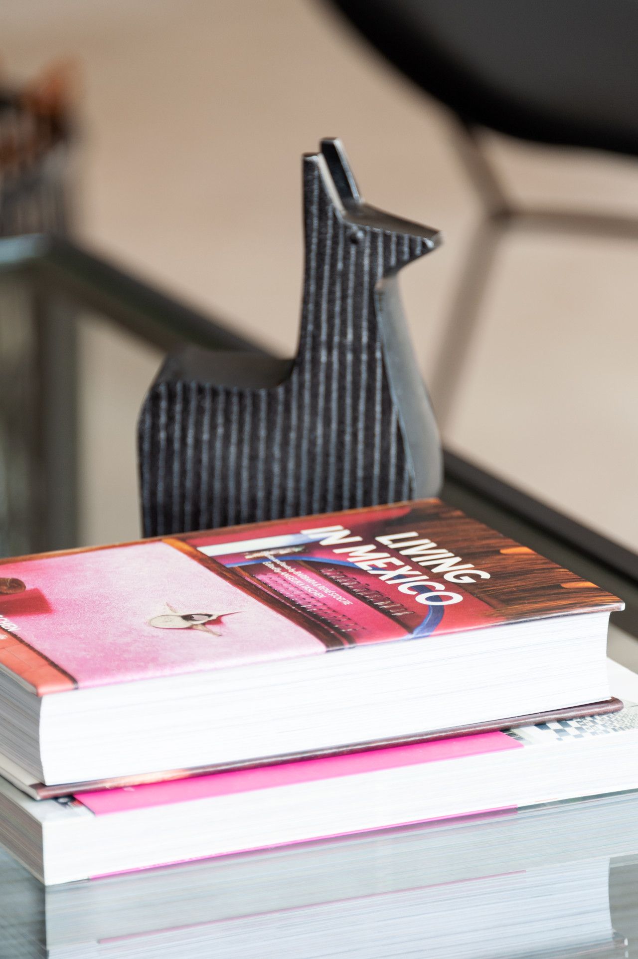 A stack of books with a visible title on the top book.