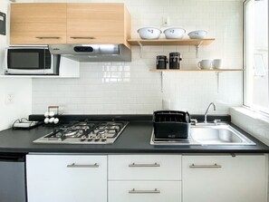 Fridge, microwave, stovetop, coffee/tea maker