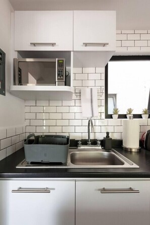 Fridge, microwave, stovetop, coffee/tea maker