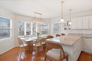 Enjoy cooking in this well-equipped kitchen with a central island, dishwasher, and ample dining space.