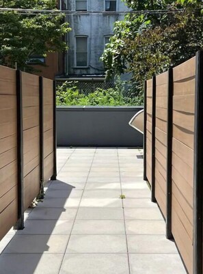 Leading to a serene escape, this corridor offers a glimpse into a tranquil space.