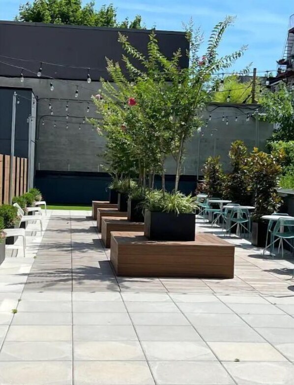 Outdoor patio with planters and seating area.