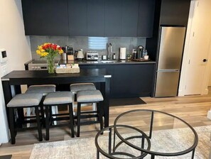 Enjoy cooking in this well-equipped kitchen with a central island, appliances, and ample seating for four.