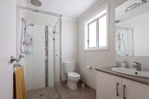 Shower, hair dryer, towels, soap