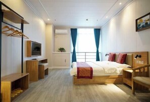 A modern hotel room with a bed, TV, wooden furniture, and a window with curtains. - Hedi Express Hotel, Hefei (Hefei)