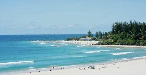 On the beach, sun loungers, beach towels