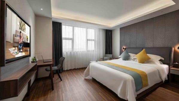 A modern hotel room with a large bed, a desk, a TV, and a window with curtains. - Citadines Zhengda Mall Hefei (Hefei)