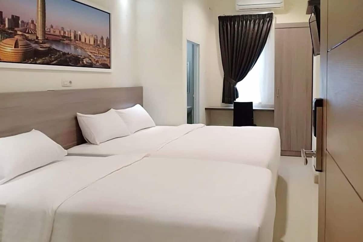 Habitación ejecutiva doble | Escritorio, wifi gratis, ropa de cama