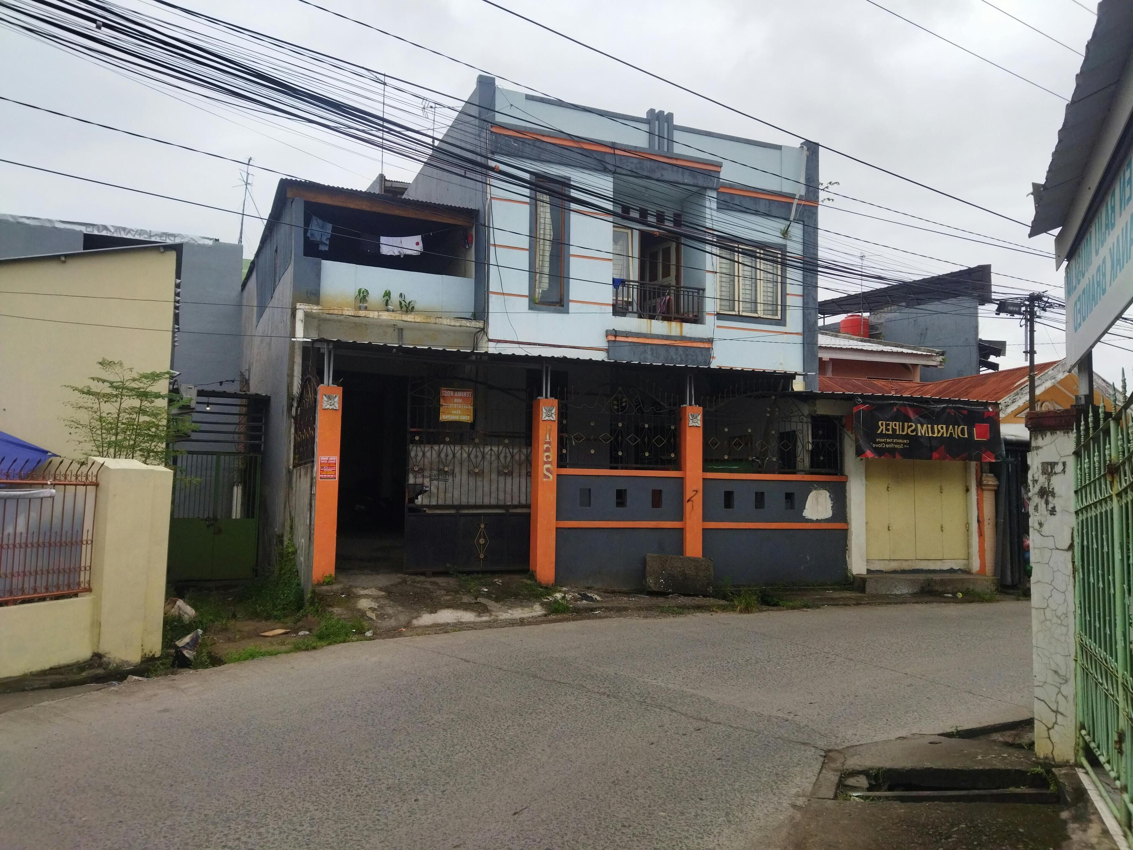 A two-story building with a commercial ground floor.