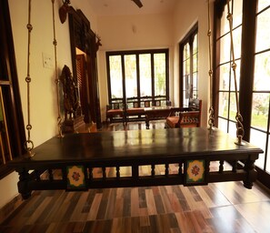 Premium Room, 1 King Bed, Garden View | Living area | 32-inch LCD TV with satellite channels, TV - Marvels villa (Tindivanam)