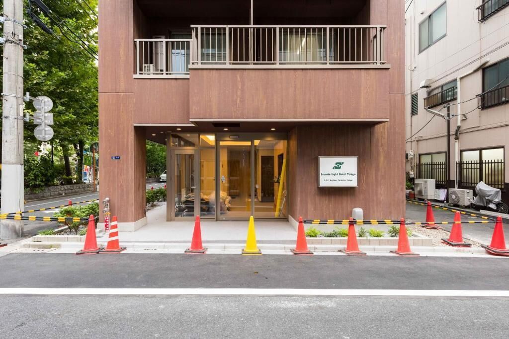 A two-story building with a sign indicating it is a private clinic.