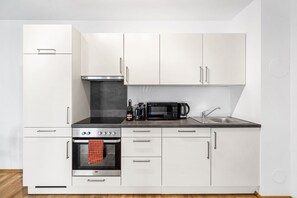 Fridge, stovetop, coffee/tea maker, cookware/dishes/utensils