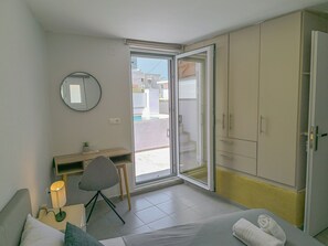 1 bedroom, desk, iron/ironing board, travel cot