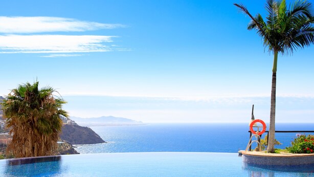An infinity pool with a clear view of the ocean and distant mountains. - Belle Vue by Interhome (Almuñécar)