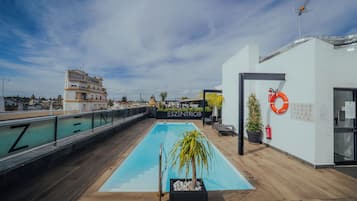 Seasonal outdoor pool, open 9:30 AM to 7:30 PM, pool umbrellas