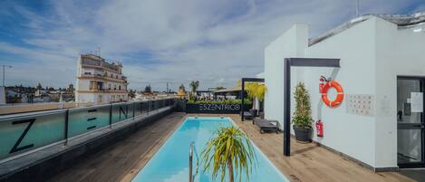 Seasonal outdoor pool, open 9:30 AM to 7:30 PM, pool umbrellas