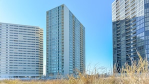 Three high-rise buildings with a clear sky.