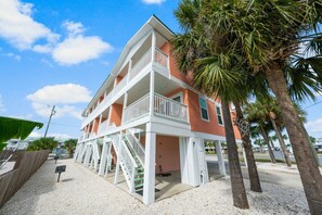 Enjoy stunning ocean views from the upper-level balcony of this beachfront property.