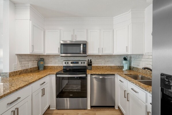 Fridge, coffee/tea maker, cookware/dishes/utensils