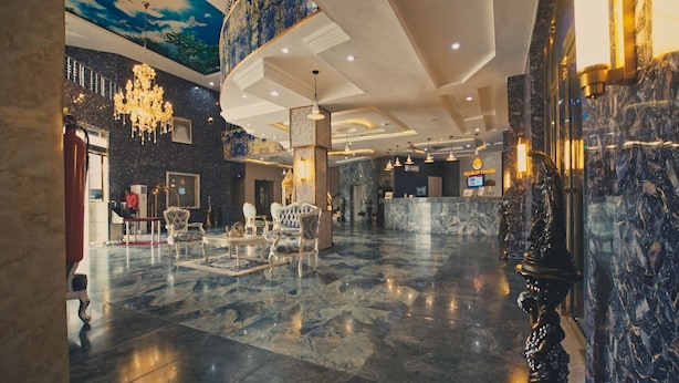 A spacious lobby with marble flooring, ornate chandeliers, and classic furniture. - Candellux Imperial Hotel and Suites (Abuja)