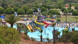 A water park with multiple slides and a central tower. - Baja Off the Grid, Luxury Nature Glamping Retreat (Cabo Punta Banda)