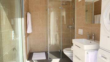 Basic Apartment | Bathroom | Shower, rainfall showerhead, hair dryer, bathrobes