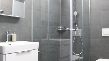 Standard Studio | Bathroom | Shower, rainfall showerhead, hair dryer, bathrobes