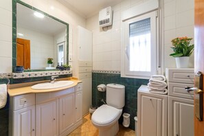 Bathtub, hair dryer, towels