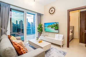Design Apartment | Living area | 55-inch Smart TV with cable channels, TV, Netflix - Tanin - Fabulous Apt With Burj Khalifa View From Balcony (Dubai)