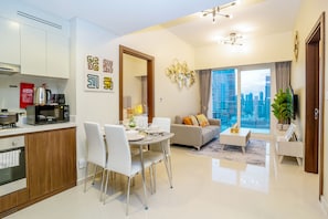 Design Apartment | Living area | 55-inch Smart TV with cable channels, TV, Netflix - Tanin - Fabulous Apt With Burj Khalifa View From Balcony (Dubai)