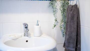 Hair dryer, towels, soap, shampoo