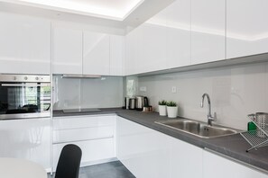 Standard Apartment | Private kitchen | Full-sized fridge, oven, stovetop, dishwasher - Stellar 3BR Apartment with Balcony (Palaio Faliro)