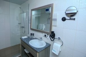 Basic Twin Room | Bathroom | Free toiletries, hair dryer, bathrobes, slippers - Riviera Suites (Lagos)