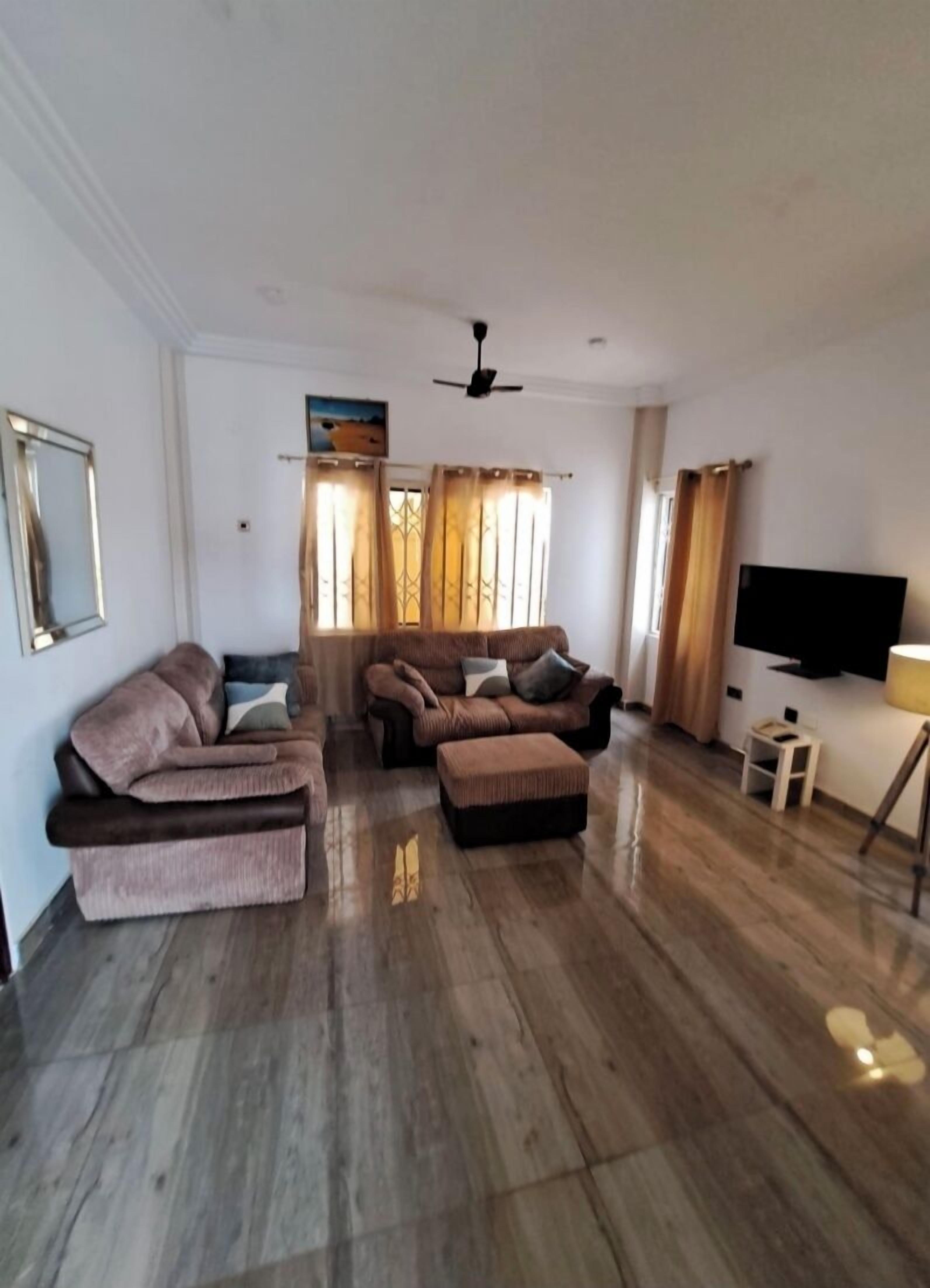 Apartment Queen Bed | Living area | Flat-screen TV