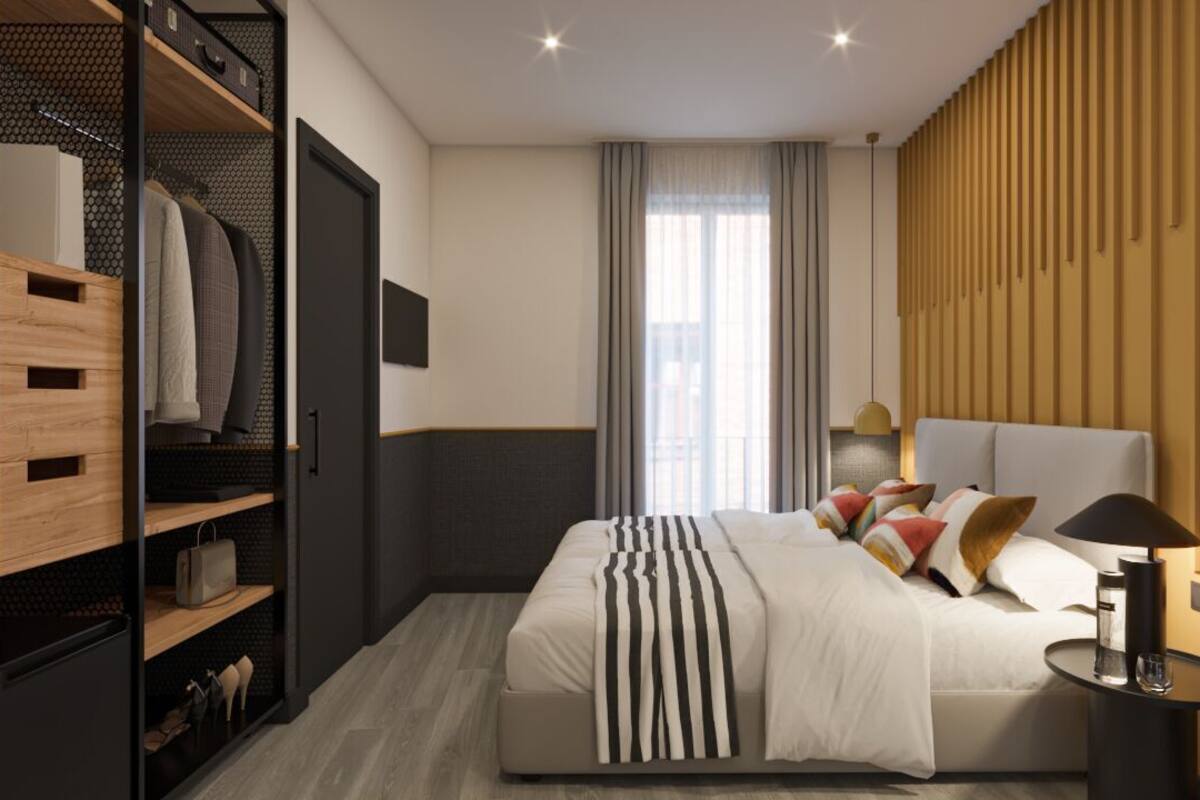 Quarto moderno com cama, guarda-roupa e mesa de cabeceira.