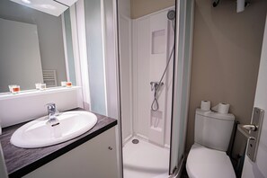 A bathroom with a white sink, a glass-enclosed shower, and a toilet. - SEA VIEW 2-PERSON APARTMENT, 1ST FLOOR "HOUAT" (La Bernerie-en-Retz)