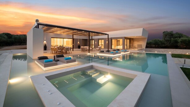 A modern house with a swimming pool, outdoor seating, and a covered patio area. - Villa El - Luxury villa for an exclusive vacation in Crete (Kournás)