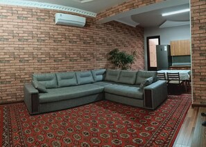 Luxury Suite | Living area | 42-inch flat-screen TV with digital channels, TV, Netflix - House4you (Tashkent)