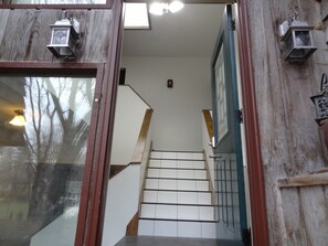 A wooden staircase with white steps leading to a landing. - 3 blks to St. Marys 3,800 sq ft Covered By Faith (Rochester)