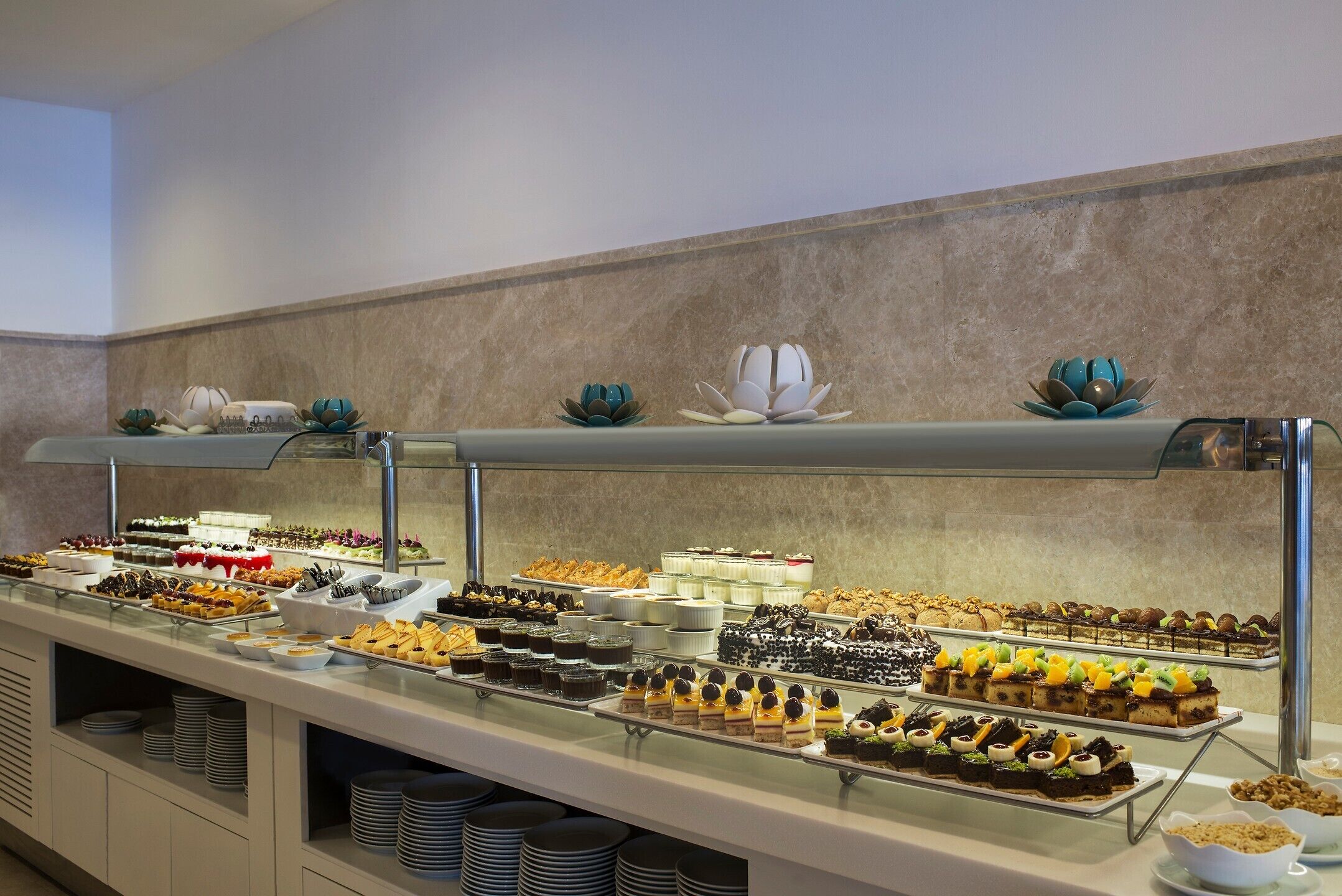 A buffet with various desserts and pastries.