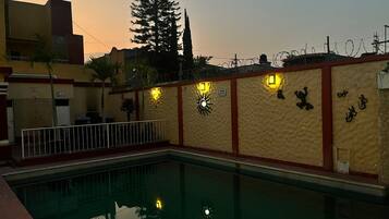 Outdoor pool, open 8:00 AM to 11:00 PM, pool umbrellas