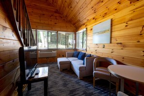 Superior Three-Bedroom Chalet | Living area | 32-inch TV with cable channels - Depe Dene Lakeside Resort (Lake George)