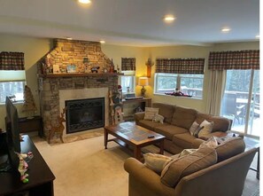 Smart TV, fireplace, DVD player, books