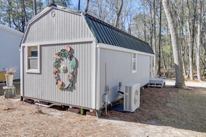 A simple, functional storage building in a natural setting.