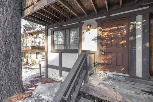 Traditional building with a welcoming entrance and cozy porch area.
