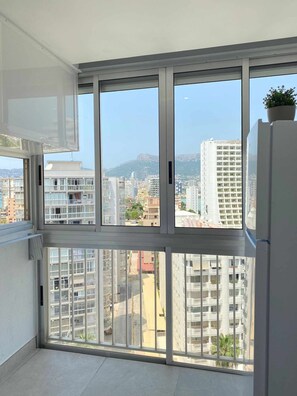 Enjoy expansive city views from the large window in this stylish apartment.