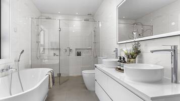Shower, hair dryer, towels, soap