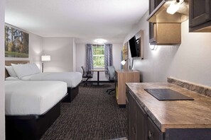 A hotel room with two beds, a desk, a chair, a TV, and a window with curtains. - Days Inn by Wyndham Salisbury, NC (Salisbury)